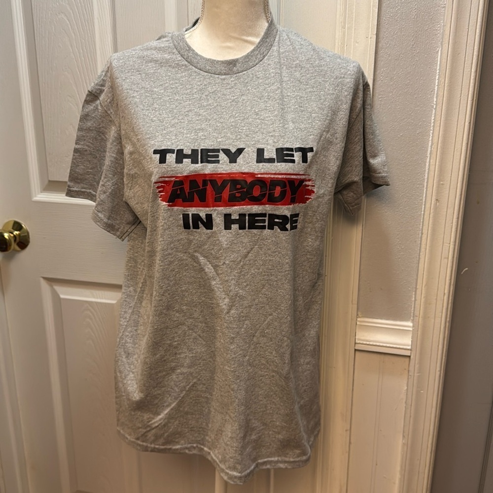 They let anybody in here graphic tshirt